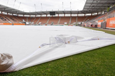 Photo for LUBIN, POLAND - MARCH 26, 2019:  Stadium Zaglebie with covered turf to protect against frost. - Royalty Free Image
