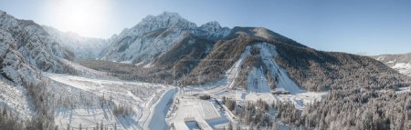 Photo for Ski Jump in Planica near Kranjska Gora Slovenia covered in snow at winter time. Aerial Panorama - Royalty Free Image