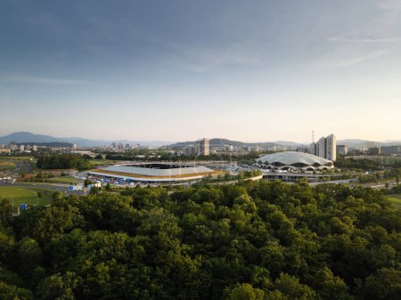 Football stadium of sports park in Ljubljana, Slovenia, aerial shot. Recreational park landscape concept.