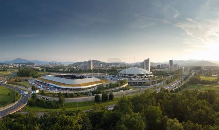 Spectacular scenery of the football stadium in Ljubljana, Slovenia at sunset, drone shot. Nature and modern architecture concepts.