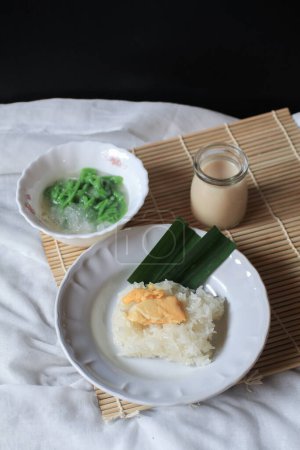 Asian Thai dessert, Sticky rice with durian in coconut milk and Lod Chong on table.