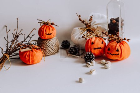 Photo for Halloween pumpkins on a table - Royalty Free Image