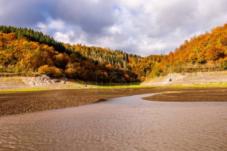 Photo for Autumn hike along the Eder dam to the sunken city of Lake Eder Atlantis - Edertal - Hesse - Germany - Royalty Free Image