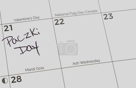 Téléchargez les photos : Paczki Day marked on a calendar on Mardi Gras (Fat Tuesday). Paczki Day is a Polish-American tradition. - en image libre de droit