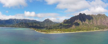Photo for View of the Ko'olau Mountains taken from Moloki'i (Chinaman's Hat) off the east coast of Oahu in Hawaii. The mountains are dormant fragmented remnant of the eastern or windward shield volcano. - Royalty Free Image