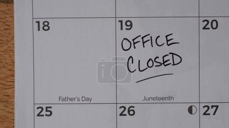 Photo for Office Closed marked on a calendar in observance of the Juneteenth holiday. Juneteenth is a federal holiday in the United States commemorating the emancipation of enslaved African Americans - Royalty Free Image