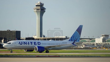 Photo for Chicago, IL, USA - July 18 2023: United Airlines Boeing 737 Max 8 taxies on the runway after landing at Chicago O'Hare International Airport. - Royalty Free Image