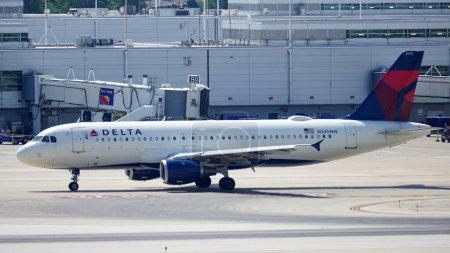 Photo for Delta Airlines plane taxies on the runway after landing at Chicago Midway International Airport. - Royalty Free Image