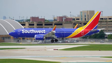 Photo for Southwest Airlines Boeing 737 plane lands on the runway at Chicago Midway International Airport. - Royalty Free Image