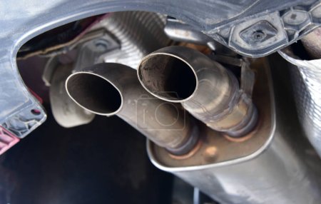 Photo for Exhaust pipe muffler under the car - Royalty Free Image