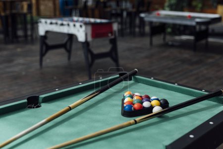 billiard ball table in dramatic light. green table colour balls. leisure activity.