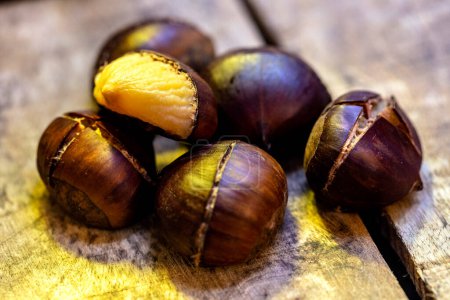 Photo for Chestnuts on wooden board - Royalty Free Image