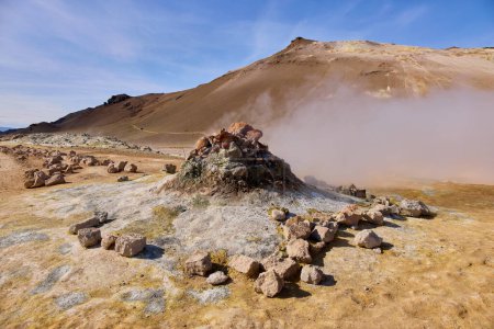 Hverir, Iceland. A surreal, bare orange-red, geothermal area at the foot of Namafjall. Full of fumaroles, mud pools, steam vents. It's on Route 1. It is also called Namaskard Hverir.