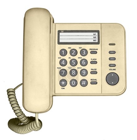 Un teléfono fijo amarillo (año 2010) con botones numéricos y un cable retorcido