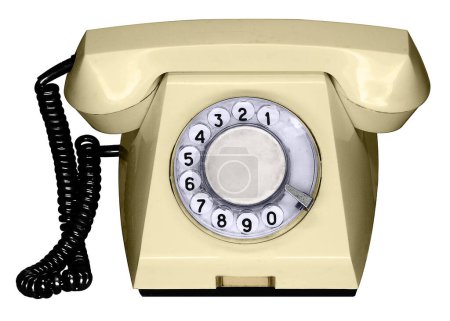 Teléfono fijo amarillo (año 1985) con disco redondo y cable negro
