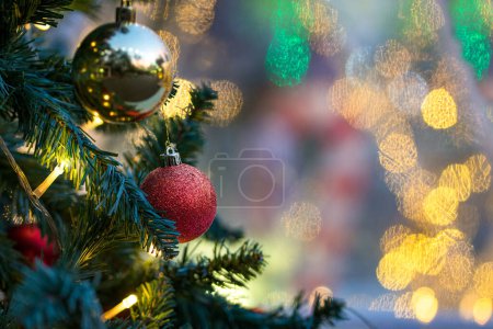 Photo for Christmas balls hanging on tree with light bokeh background. Copy space. - Royalty Free Image
