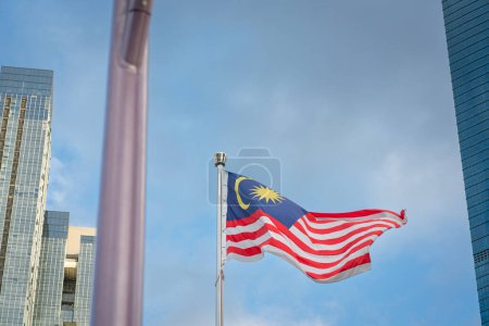 Photo for Kuala Lumpur, Malaysia - January 28, 2024: Malaysia flag on a pole waving up in the sky, in the city of Kuala Lumpur - Royalty Free Image