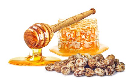Photo for Dripping honey, honeycomb and tiger nuts isolated on white background - Royalty Free Image
