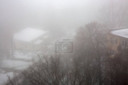 Photo for Urban landscape with very dense fog in Kyiv, Ukraine. - Royalty Free Image
