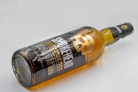 Foto de Kyiv, Ukraine - December 26, 2021: Smokehead Islay single malt Scotch whisky bottle closeup on white. - Imagen libre de derechos