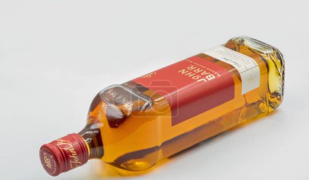 Photo for Kyiv, Ukraine - May 26, 2022: Studio shoot of John Barr blended Scotch Whisky bottle against white. It is a brand of Whyte and Mackay company producing alcoholic beverages. - Royalty Free Image