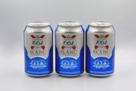 Photo for Kyiv, Ukraine - December 25, 2022: Studio shoot of Kronenbourg Blanc 1664 wheat beer with citrus cans closeup on white. The company is owned by the Carlsberg Group. - Royalty Free Image