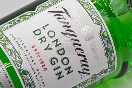 Photo for Kyiv, Ukraine - July 20, 2023: Studio shoot of Tanqueray London dry gin bottle label closeup against white. Gin is a distilled alcoholic drink that derives its predominant flavor from juniper berries. - Royalty Free Image