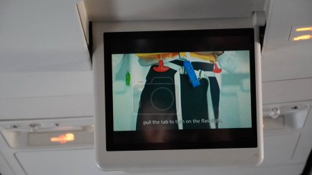 Photo for LCD Screen in Airplane with movie explanation. Passenger plane interior with informational screen - Royalty Free Image