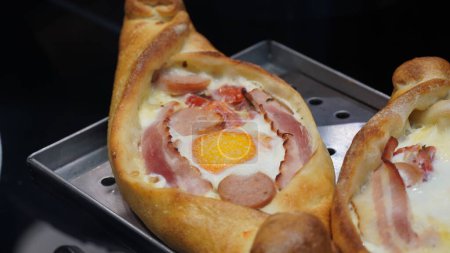 Photo for A kind of khachapuri food with bacon and sausages - Royalty Free Image