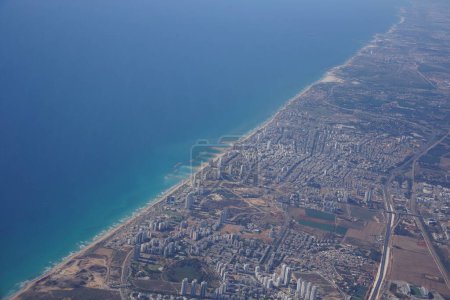 Photo for Netanya areal view from plane. It is a city in the Northern Central District of Israel, and is the capital of the surrounding Sharon plain. - Royalty Free Image