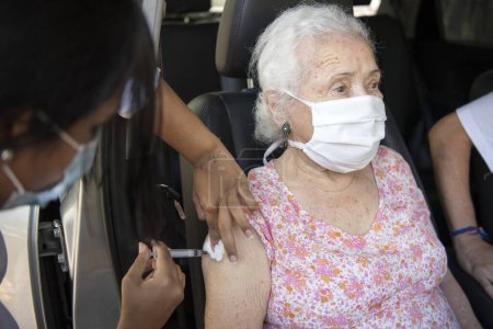 Photo for Rio de Janeiro, Brazil - February 04, 2021: UERJ expands care for drive-thru vaccination of the elderly against Covid-19 at the Maracan Campus. People from 92 years - Royalty Free Image