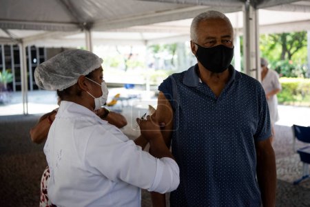 Photo for Rio de Janeiro, Brazil - March 19, 2021: Men from 75 years old were vaccinated with CoronaVac at UERJ Campus Maracan, north zone of Rio de Janeiro.Combat the coronavirus - Royalty Free Image