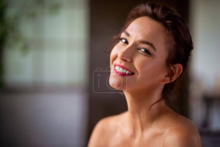 Photo for Headshot of a brunette haired mid aged woman cheerful smiling and looking at camera. - Royalty Free Image