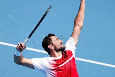 Photo for MELBOURNE, AUSTRALIA - JANUARY 11: Marin Cilic of Croatia serves to Sir Andy Murray of Great Britian during day one of the 2024 Kooyong Classic at Kooyong on January 11, 2024 in Melbourne, Australia. - Royalty Free Image