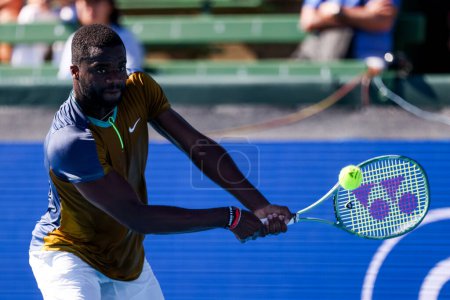 Photo for MELBOURNE, AUSTRALIA - JANUARY 11: Frances Tiafoe of USA hits a backhand against Zhang Zhi Zhen of China during day one of the 2024 Kooyong Classic at Kooyong on January 11, 2024 in Melbourne - Royalty Free Image