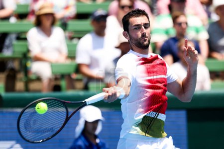 Photo for MELBOURNE, AUSTRALIA - JANUARY 11: Marin Cilic of Croatia whilst playing Sir Andy Murray of Great Britian during day one of the 2024 Kooyong Classic at Kooyong on January 11, 2024 in Melbourne - Royalty Free Image