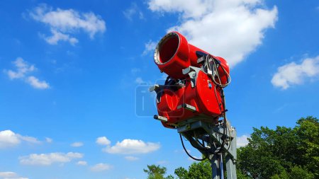 Photo for Modern red snow gun in the mountains - Royalty Free Image