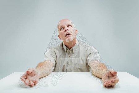 Elderly man sits with cobwebs sprawling from him, symbolizing a tiresome and lengthy wait