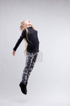 Girl in flight, her hair trailing behind, an embodiment of youthful energy and abandon