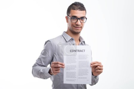 Confident and cheerful, the man shows a document, signaling readiness to proceed with a transaction