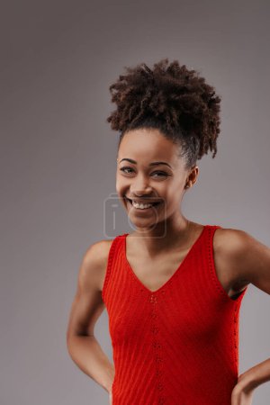 The young woman's lively smile complements her bright, casual summer wear