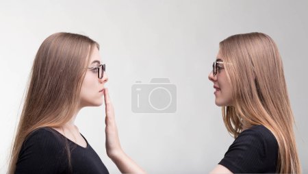 moment of self-censorship as one twin commands the other to silence