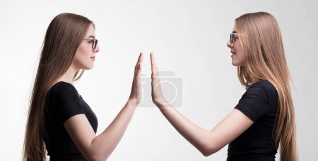Synchronous high-five, a symbol of camaraderie and self-love between she and herself
