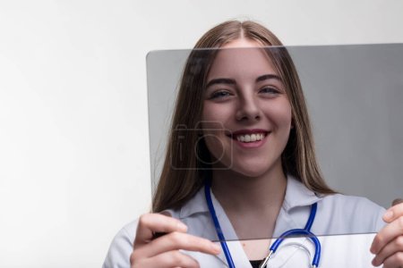 Embracing AIs potential, she wields a tablet that symbolizes the new era of medical data analysis 