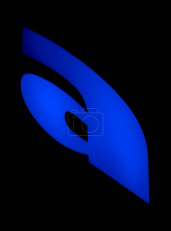 Illuminated 'a' letter in azure invites with its warmth, a gentle luminary in the silent black