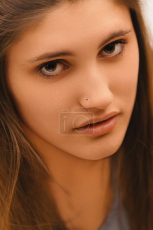 woman's piercing gaze and slightly furrowed brow convey a deep skepticism and a readiness to question further