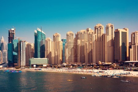 Photo for Dubai marina, modern city with skyscrapers seen from water - Royalty Free Image