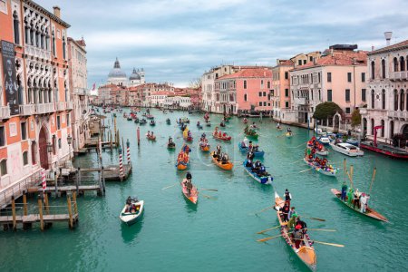 Photo for Venice, Italy, Grand canal. Venice carnival opening. Gondola boats water parade - Royalty Free Image
