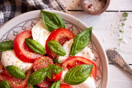 Photo for Caprese salad with mozzarella cheese and tomatoes of Italy cuisine - Royalty Free Image