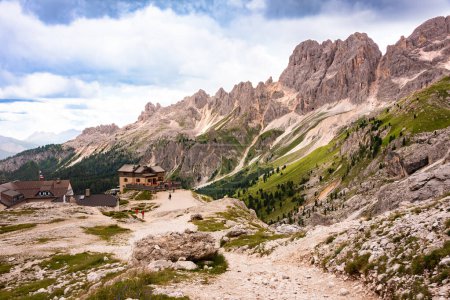 Mountain hiking trail and people walking in Dolomite alps